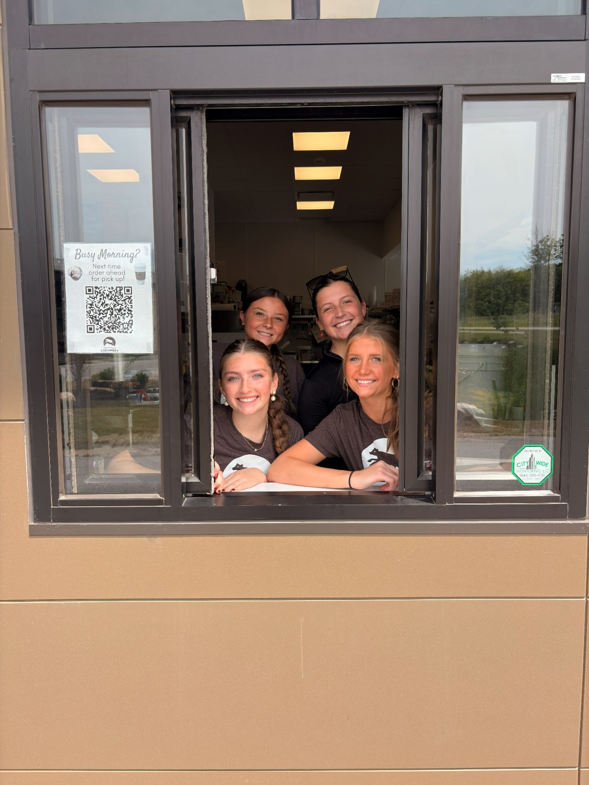 Little Mountain Creamery team smiling out the drive-thru window