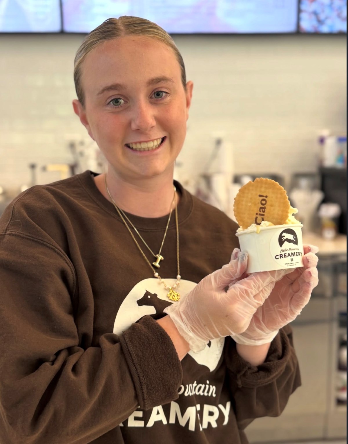 Little Mountain Creamery team member holding a gelato cup