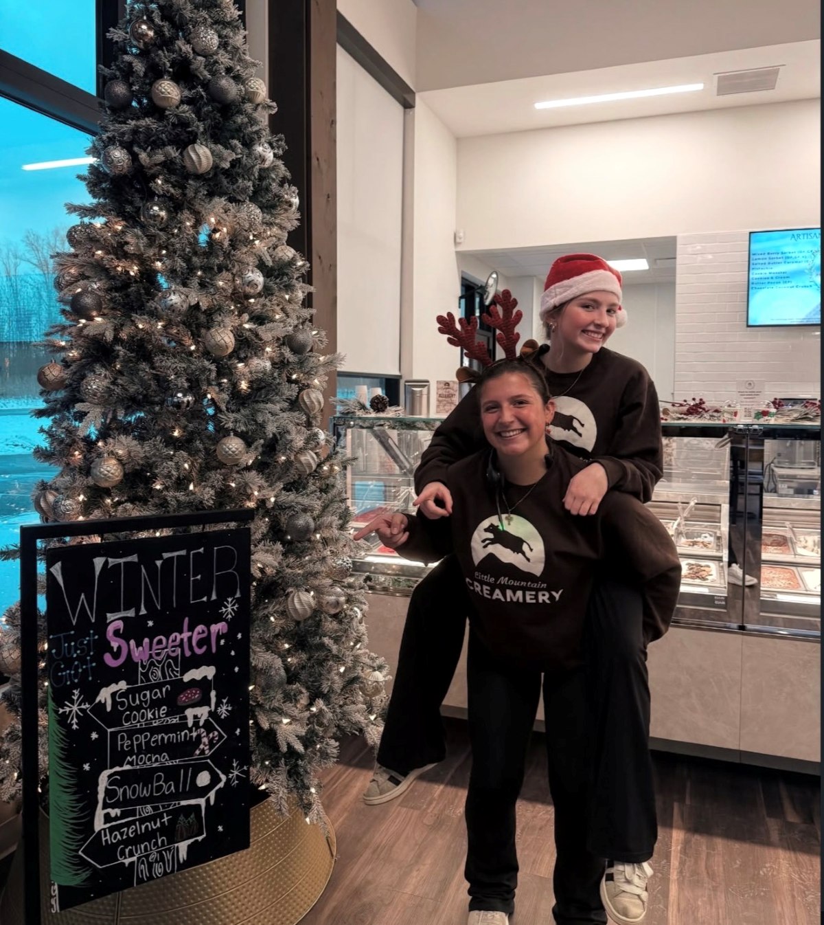 Little Mountain Creamery team celebrating the holiday season in the shop